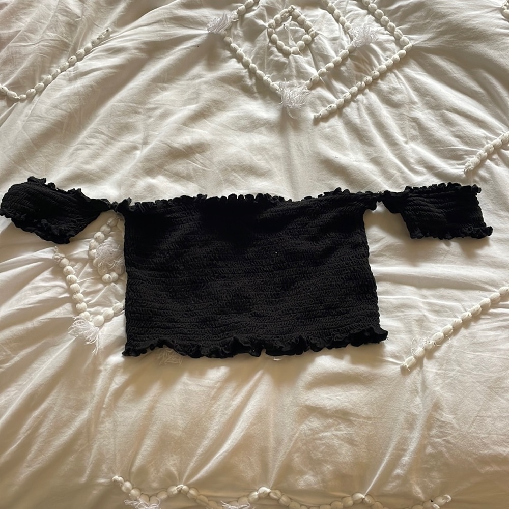 Black off the shoulder ruffled crop top